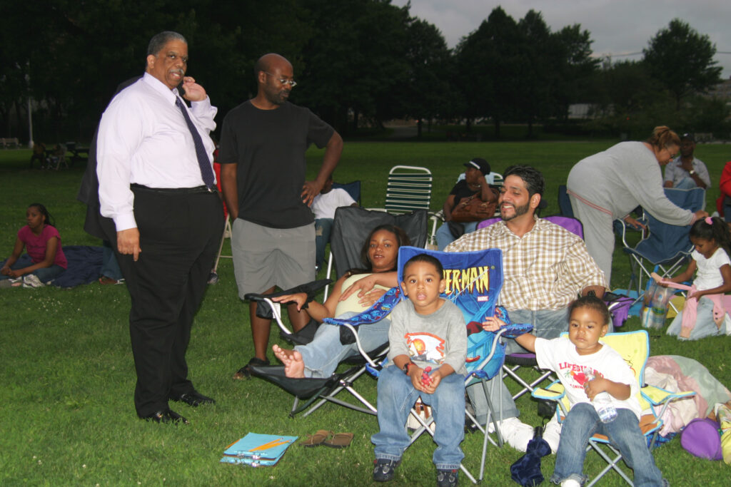 Then Council Member Leroy Comrie greeting Family Movies in the Park attendees.
