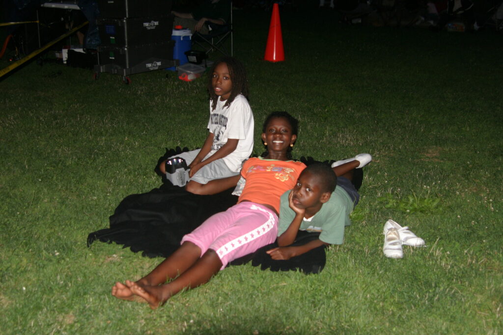 Doug, Evan and Adjoa at an early Family Movies in the Park screening.